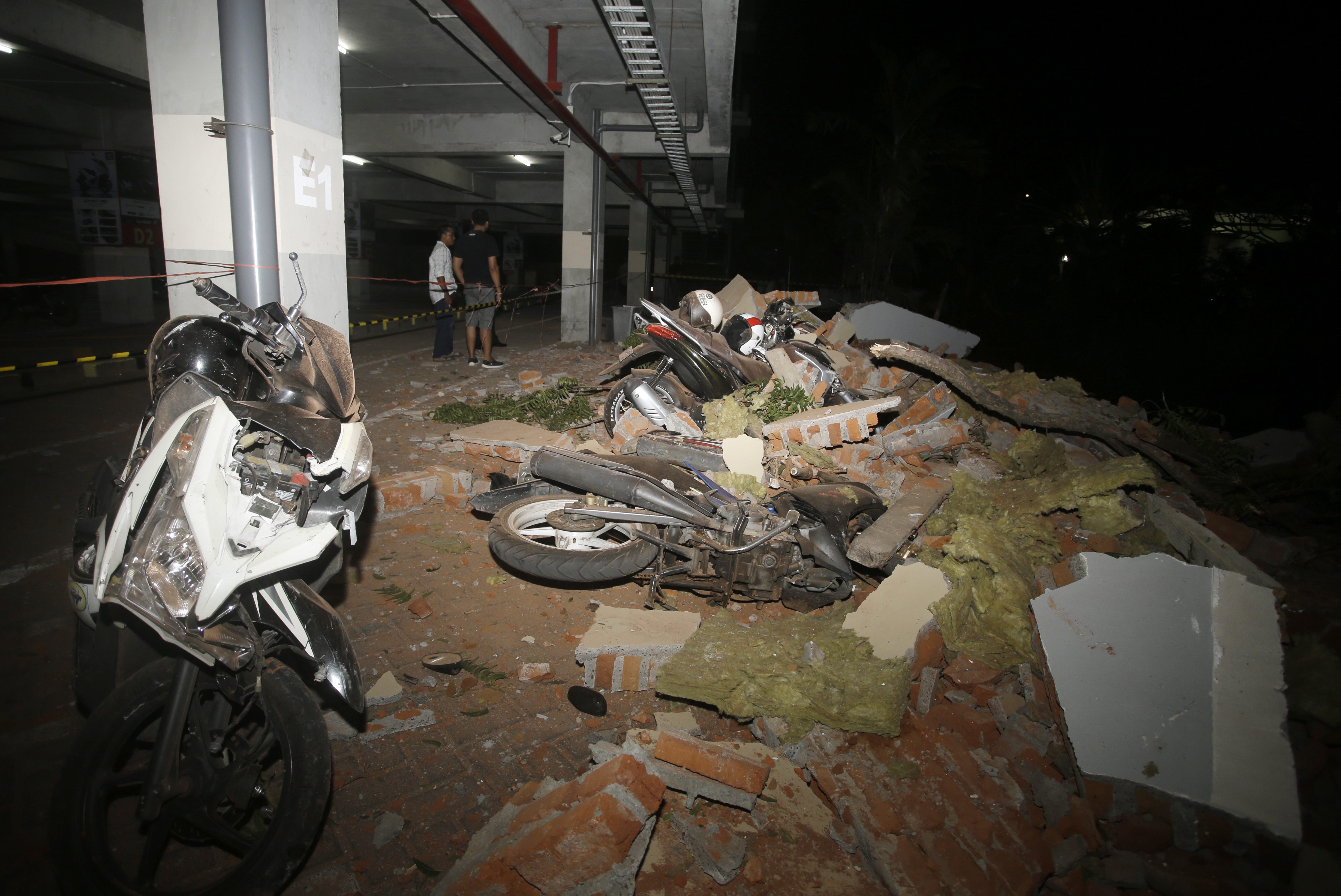 Rescuers Search For Trapped Survivors After Indonesia Earthquake Kills 82